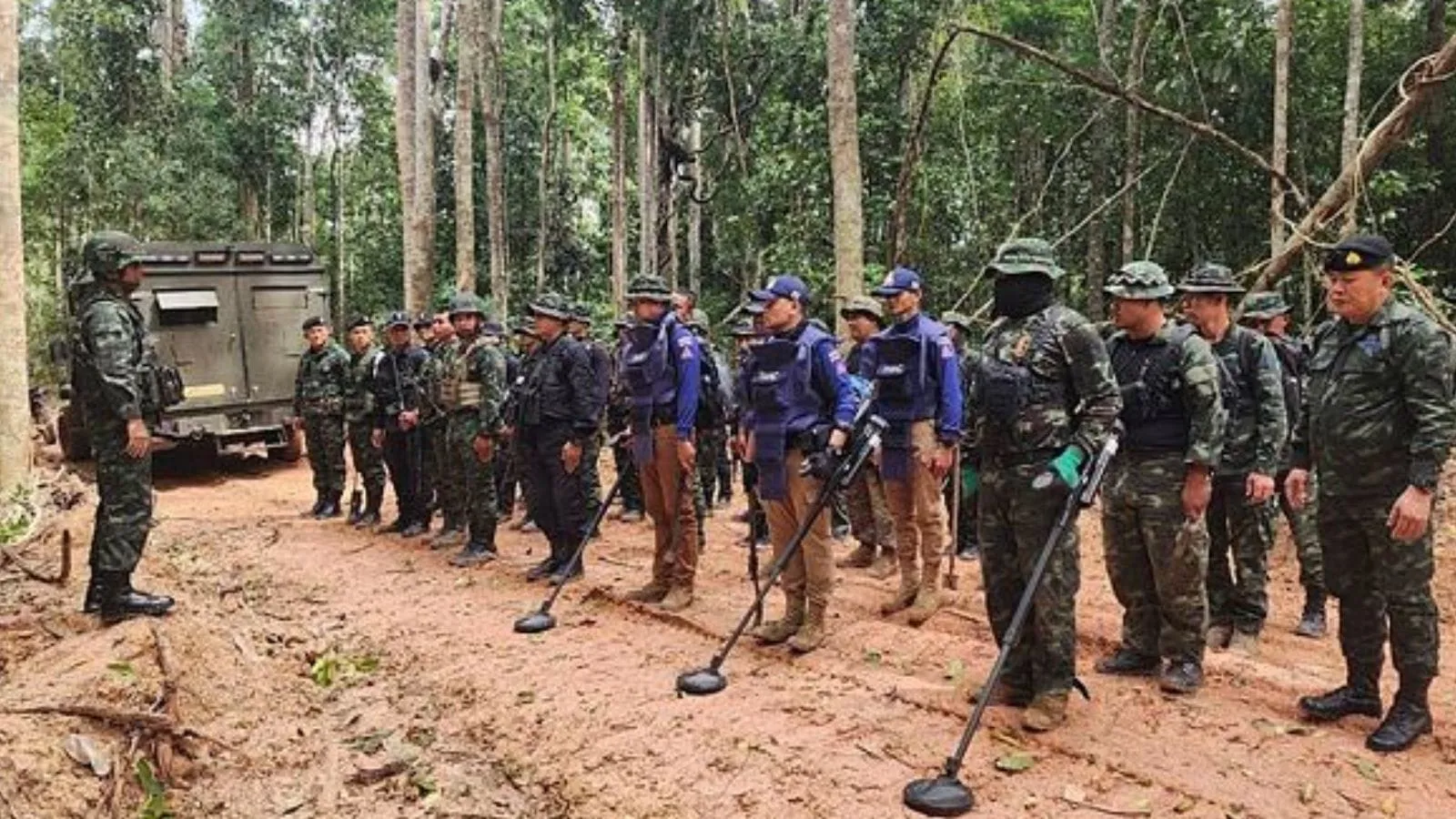 In this photo released by the Royal Thai Army, Thai soldiers inspect a border area on Sunday, July 20, 2025, in Ubon Ratchathani province, where the Royal Thai Army said two anti-personnel landmines were found.