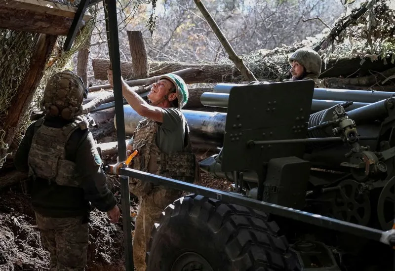 Artillerymen of the 152nd Separate Jaeger Brigade prepare to fire an M114 self-propelled howitzer towards Russian troops, near the frontline town of Pokrovsk in Ukaine's Donetsk region, on Wednesday.