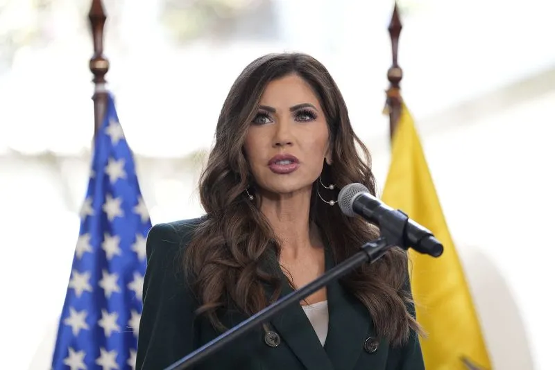 US Homeland Security Secretary Kristi Noem speaks next to Ecuador's Minister of Interior John Reimberg (out of frame) as they deliver a press briefing at the Carondelet Presidential Palace in Quito, on July 31, 2025.