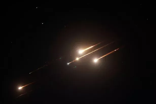 Incredible photos capture moment Iranian missile strike lights up sky above  Tel Aviv - The Mirror US