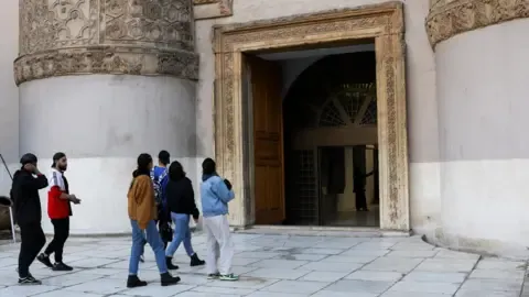 Reuters People visit the National Museum in Damascus after it reopened (9 January 2025)