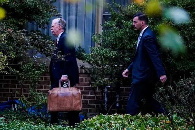 Former National Security Advisor John Bolton leaves his home in Bethesda, Maryland, U.S., October 17, 2025. REUTERS/Nathan Howard