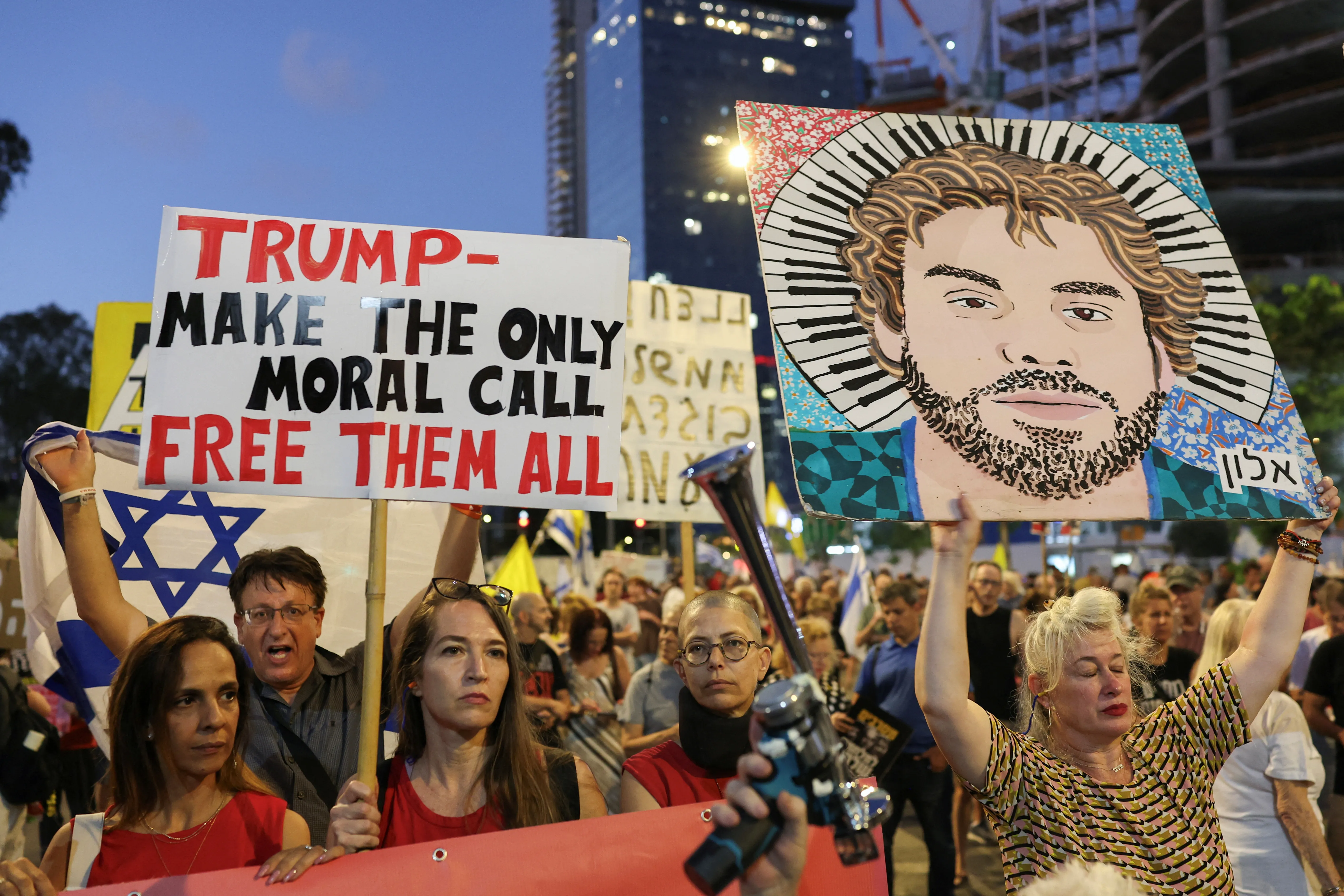 Demonstrators take part in a protest in tel Aviv demanding the immediate release of captives held in Gaza