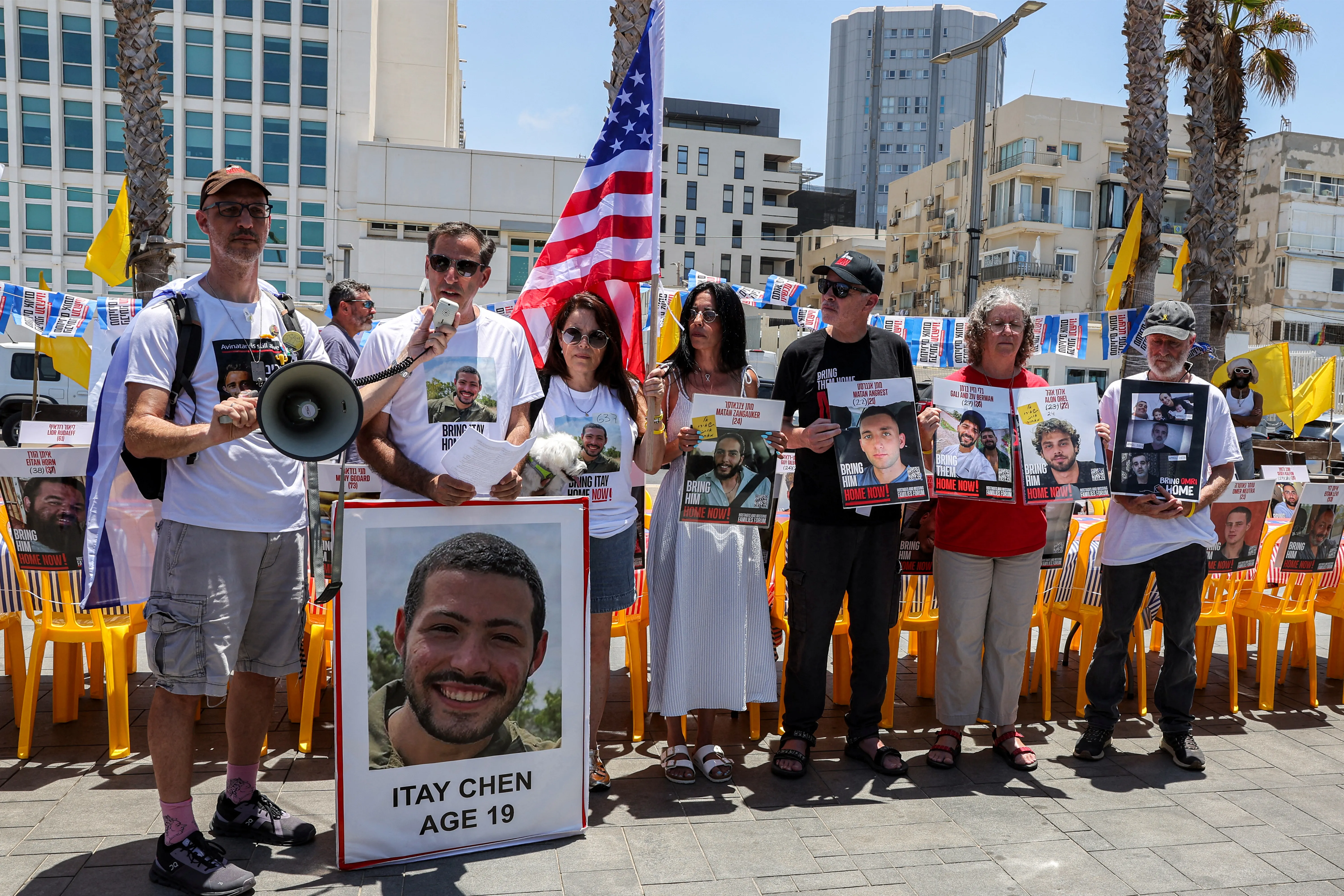 People gather during a demonstration organised by the families of Israeli hostages held in the Gaza Strip since the 2023 October 7 attacks by Palestinian militants along a beach outside the US embassy branch office in Tel Aviv on July 4, 2025 on the occasion of US Independence Day, calling upon the US to intervene for the hostages' release and for a ceasefire.