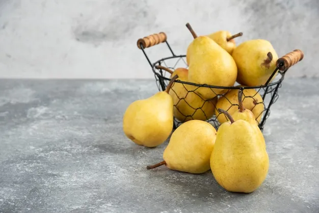 Free photo bunch of fresh yellow pears in metal bucket on marble surface.