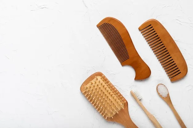 Free photo top view brush and combs on table