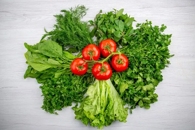 Free photo top view of bundles of fresh greens and tomatoes with stem on white background