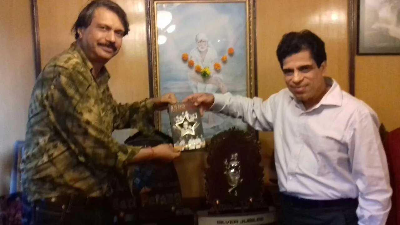 Ashim ( Shakti) Samanta blesses sr journalist Chaitanya Padukone's authored book  R D Burmania