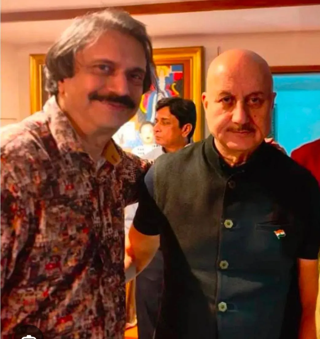 Anupam Kher ( right) with sr journalist Chaitanya Padukone
