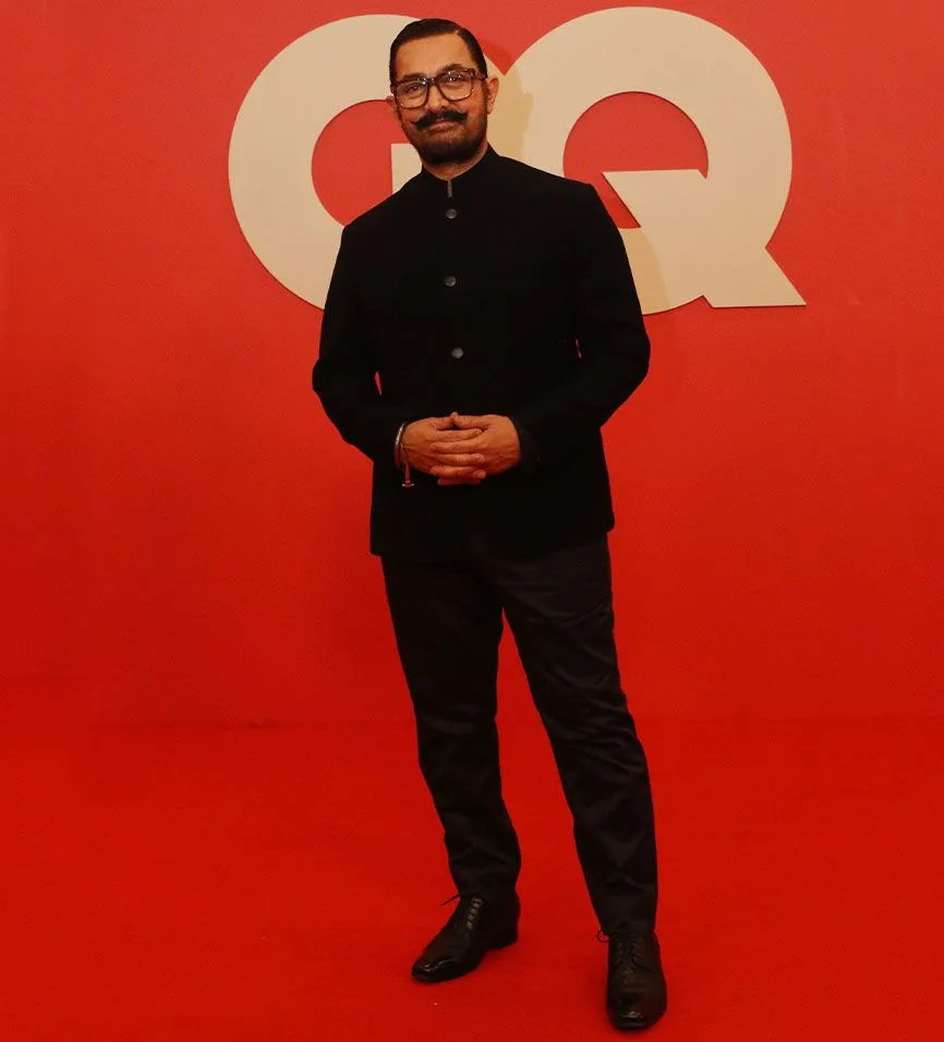 Image may contain Aamir Khan Person Standing Clothing Formal Wear Suit Adult Blazer Coat Jacket Head and Face