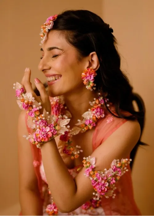 Artificial flowers add charm to the haldi and mehndi vibe