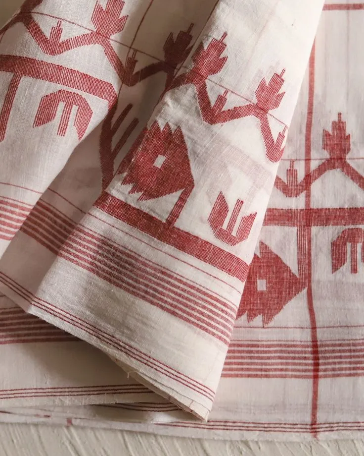 This may contain: two red and white napkins sitting on top of each other next to each other