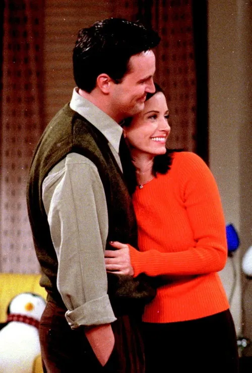 Chandler and Monica. I know this is irrelevant, but I love that Hugsy is in  the background :)