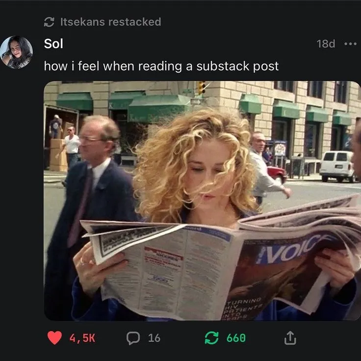 This may contain: a woman reading a newspaper on the street