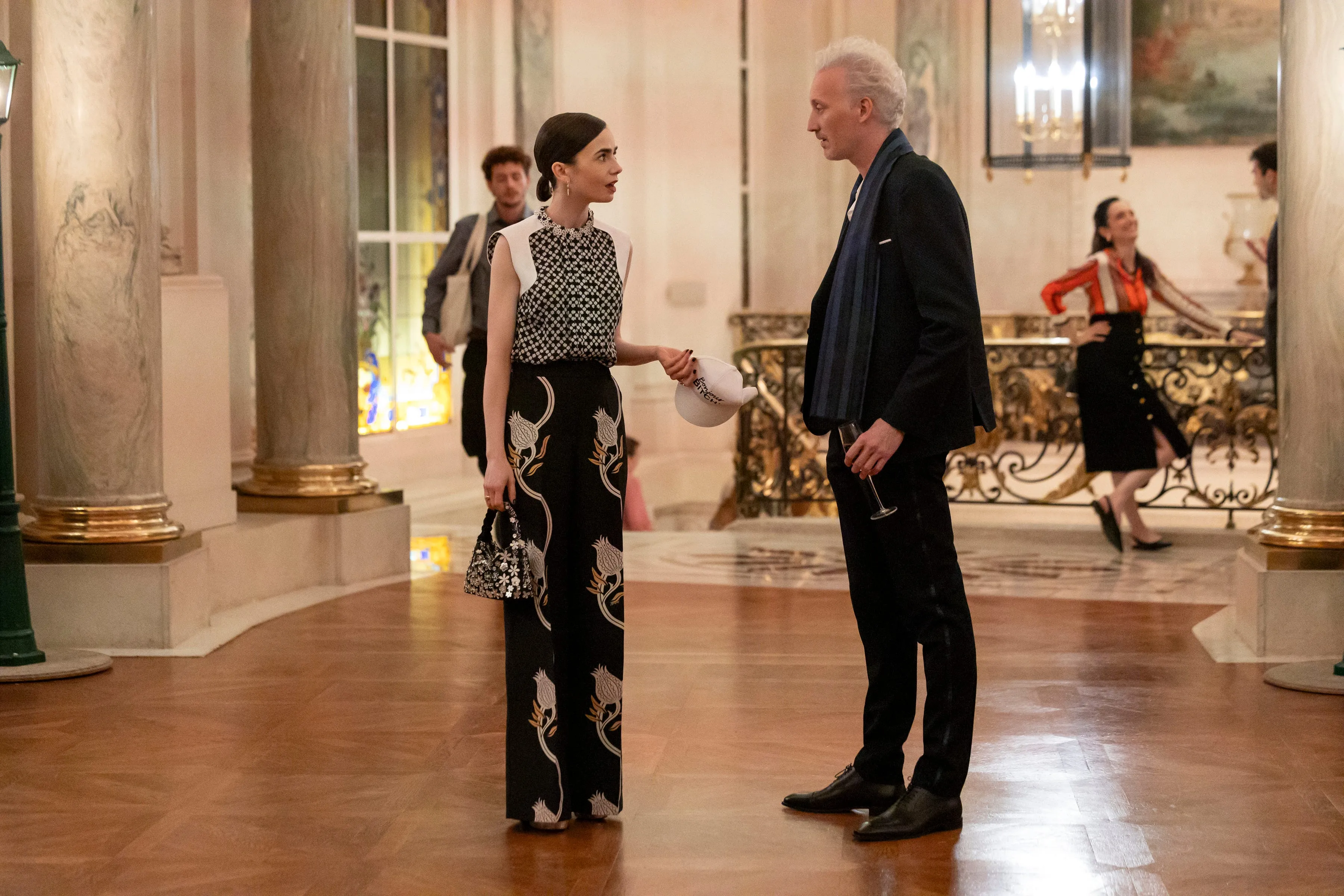 emily in paris. (l to r) lily collins as emily, bruno gouery as luc in episode 505 of emily in paris. cr. marie etchegoyen/netflix &copy; 2025