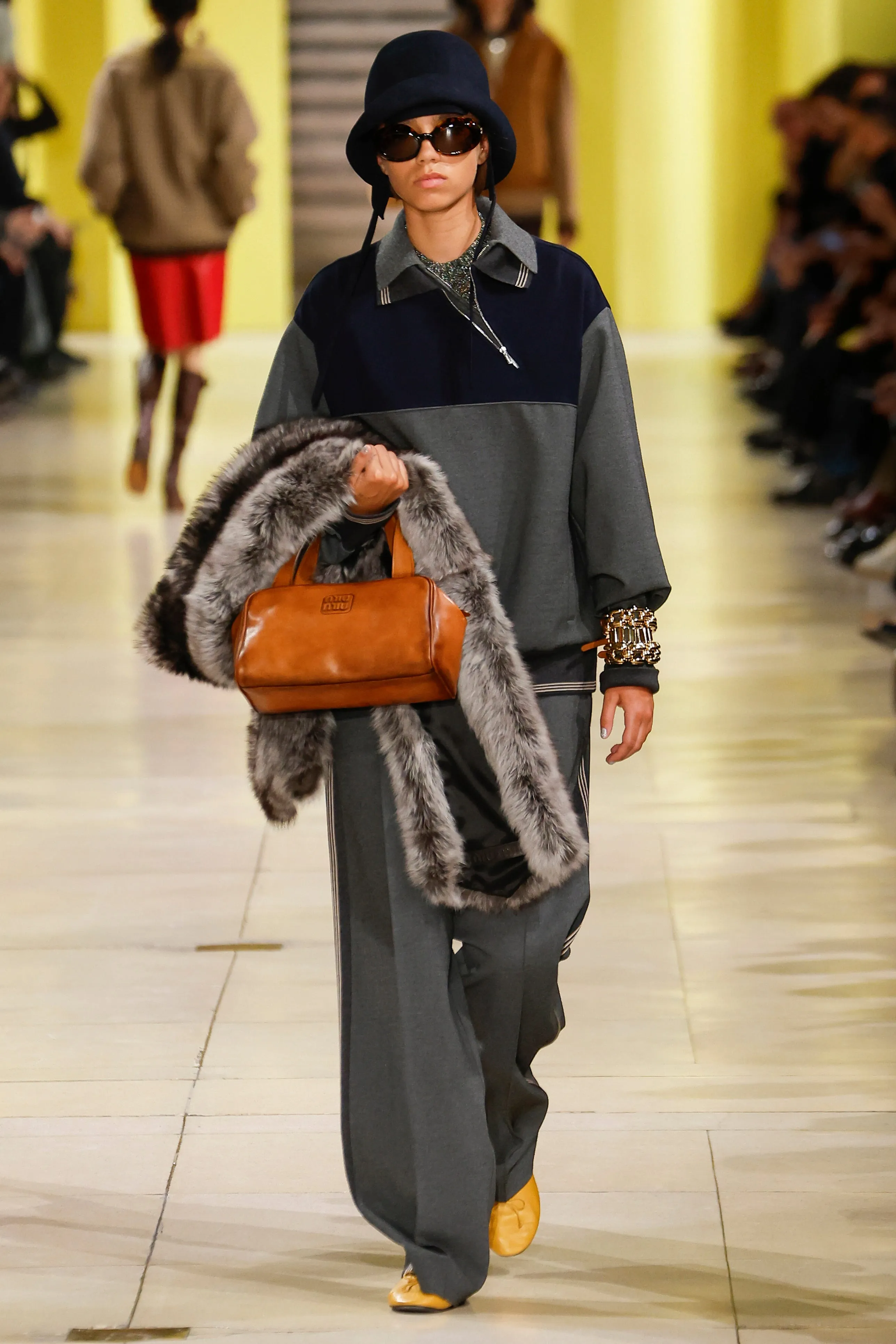 fashion runway featuring a model in a stylish outfit