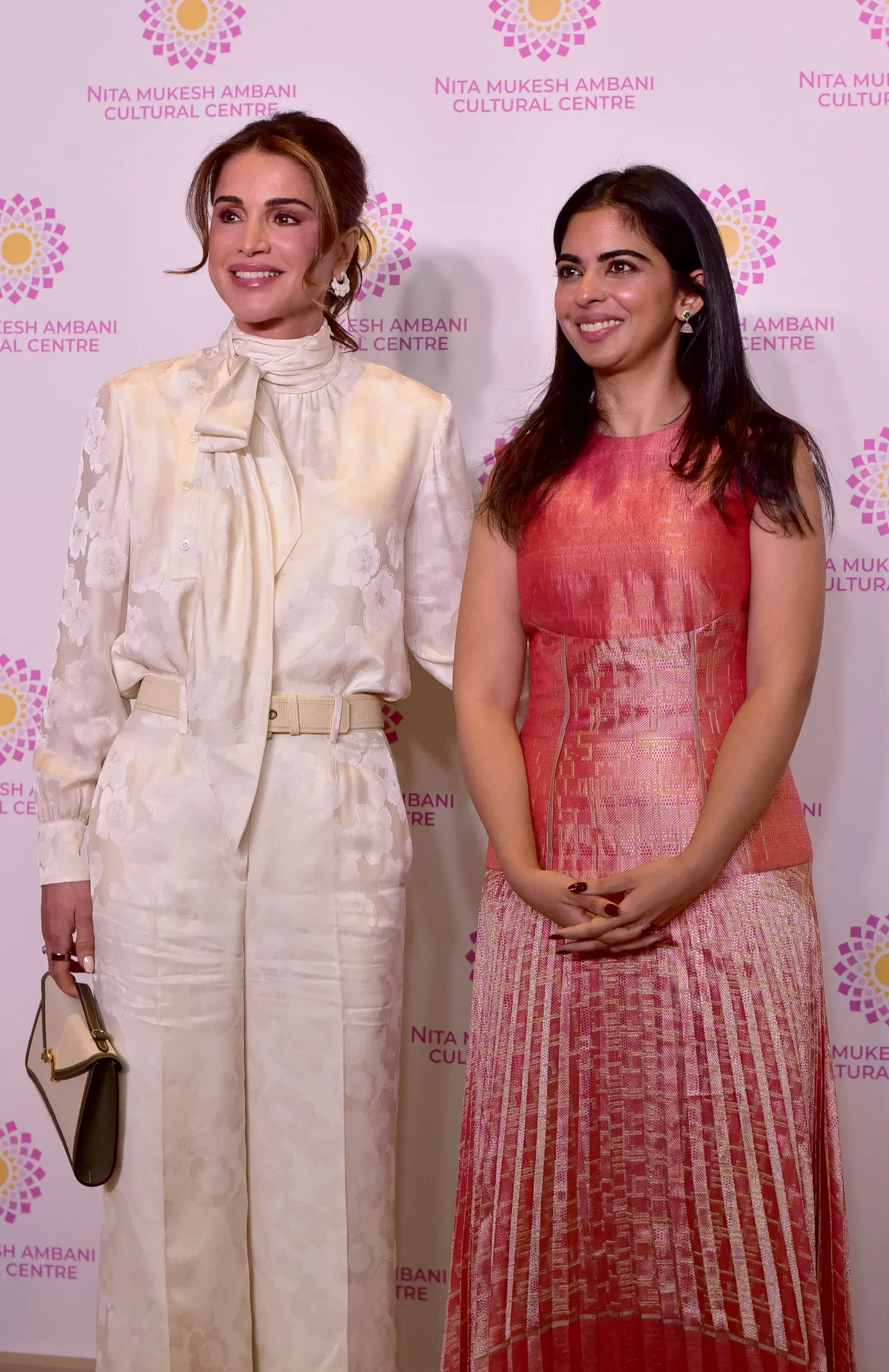 Image may contain Queen Rania of Jordan Isha M. Ambani Fashion Accessories Bag Handbag Adult Person Face and Happy
