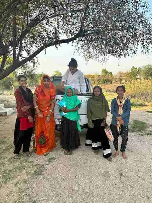 Padmaja with young girls and women who are taught in the Raj Dadisa Badan Kanwar School of Self Study.
