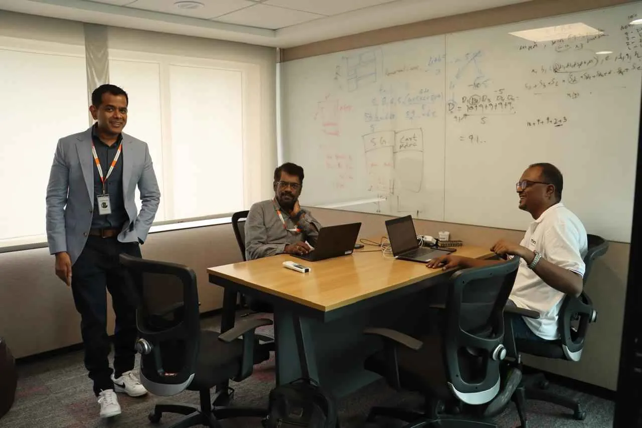 Founders Ravi Teja Putrevu, Raghav Putrevu, Dr. Aman Basheer Sheikh  together in an office setting.