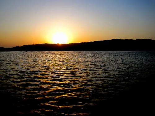 The sun setting on the Anasagar Lake