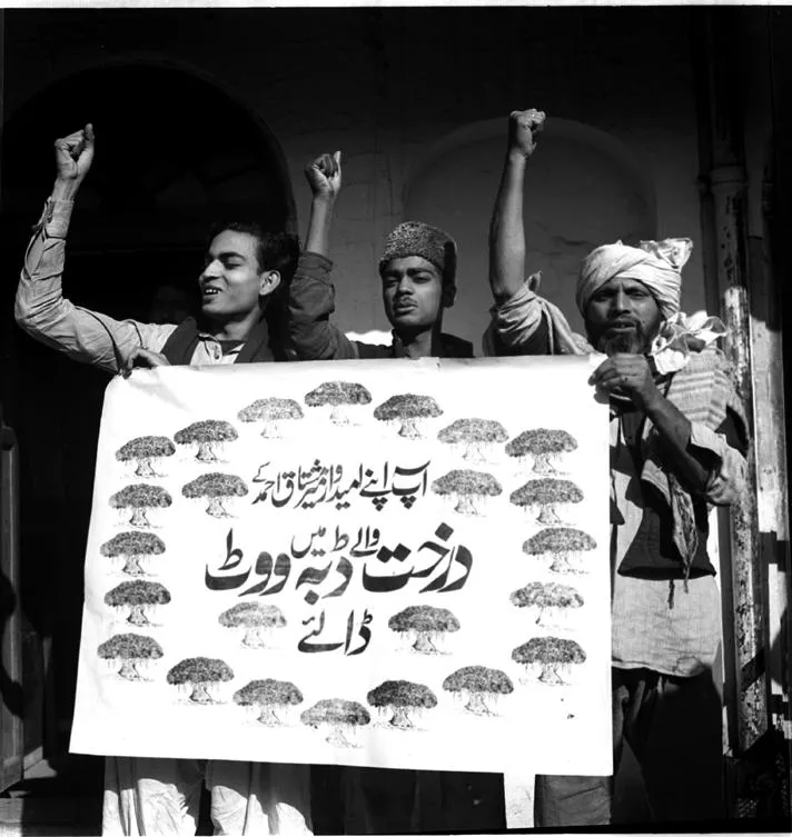 The supporters of the Socialist Party carrying a poster to appeal to voters to cast their vote in favour of their candidate.