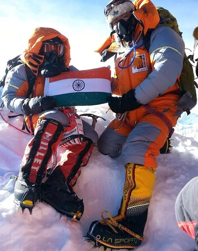 To commemorate their feat, Malavath (left), along with her fellow climber Anand, left a photo of Dr. Ambedkar and the Indian flag at the peak.