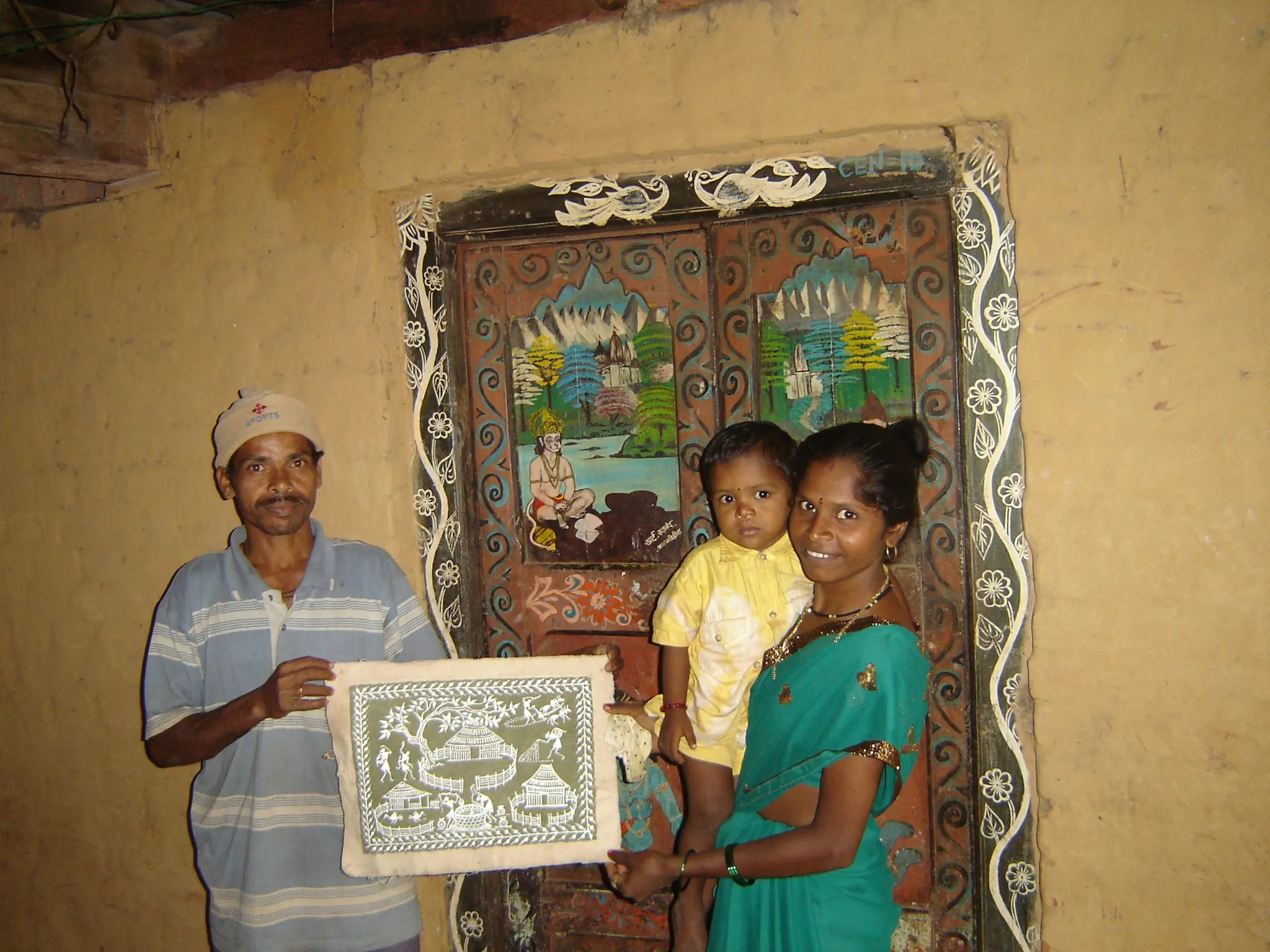 Warli artist Sadanand and his wife.