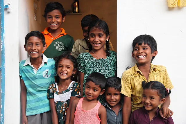 children outside a toilet