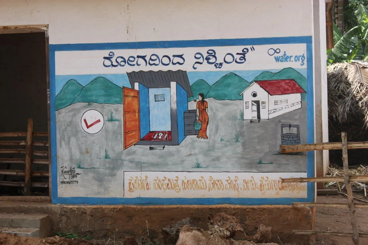 The poster translates to ‘freedom from diseases’ showing the positive effect of adopting safe sanitation practices.