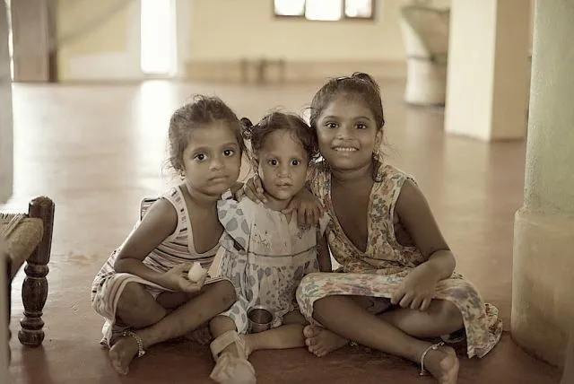 The girl in the middle is very clever except that she has multiple deformities. From a cleft lip and palate to a single arm and deformity in her legs; in the company of normal kids she has learnt how to use her disabilities to her advantage and thus enjoys the status of being everybody’s pet.