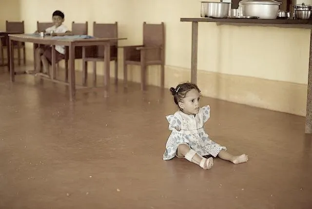 These children may evoke your sympathy in a photograph, but in reality their zest for life evokes a very special kind of happiness. This child with all her problems manages to crawl as fast as a battery operated toy car. Full of energy and an infectious love for life, like any normal kid.