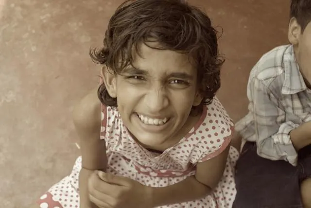 Though she’s 12 years old, this child behaves like she was five. She lives in a state of extreme excitement and disappointment speaking her own language to herself which is gibberish. She likes being in class but not the teacher.
