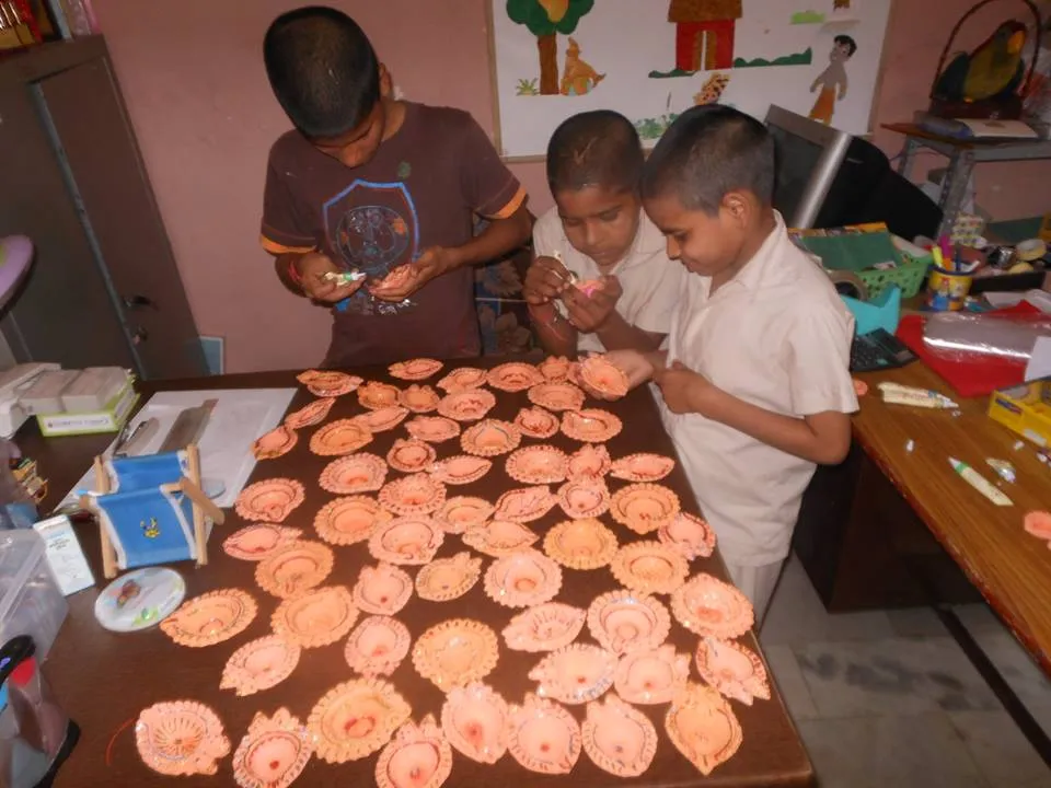 Diya decoration by painting team of Satyakam Sewa Ashram family for Deepavali.