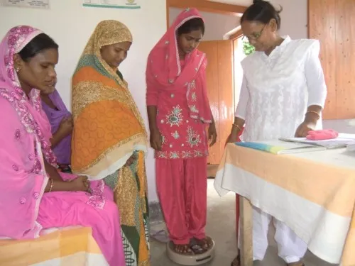 Women in Marwatoli village in Bihar’s Kishanganj district undergo weight checkup at the Health Sub Centre under supervision of Auxillary Nurse Midwife. (Credit: Ajitha Menon\WFS)