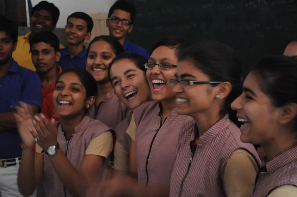  A group of girls feeling happy at being able to express their feelings towards street harassment in front of boys at KK Public School, Sardana, Meerut.