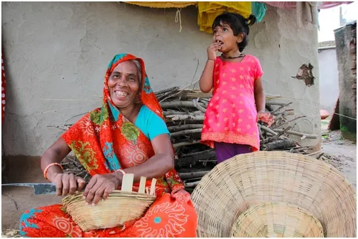 Sharada from Bhabra, MP, weaves baskets to put her grandchild through school.