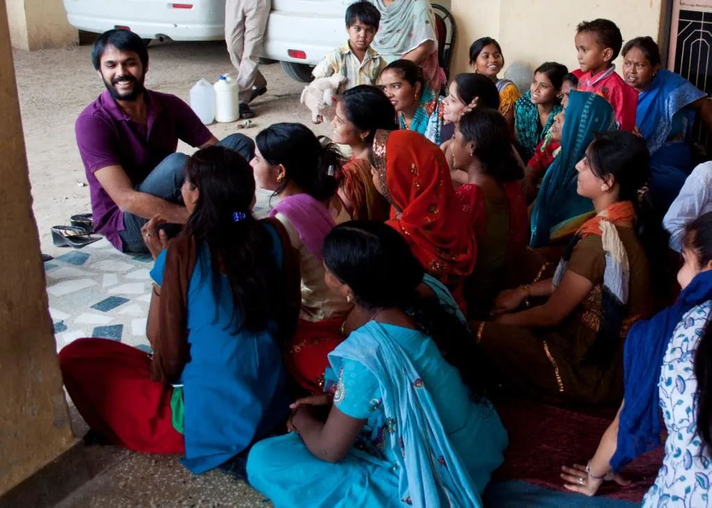 Aditya facilitating a workshop on building trust and safe spaces within the community with a group of working women in Okhla, Delhi