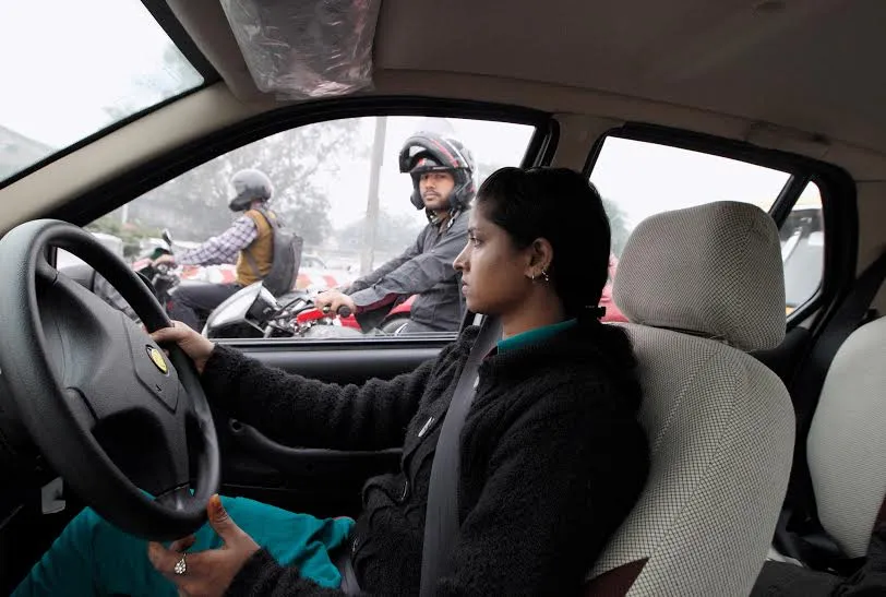 This picture of Savita, a young taxi driver in New Delhi, is one of the most memorable shots that photographer Nicolaus Schmidt took for his book. (Credit: Nicolaus Schmidt)