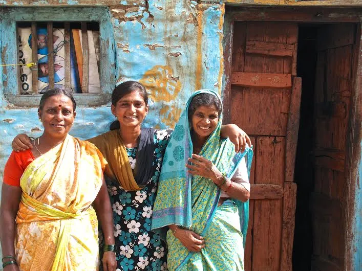 Roja with her aunt and mother in front of her house.