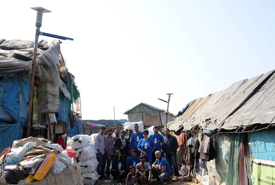 The enthusiastic team of volunteers prepares the solar bulb out of PET bottle.