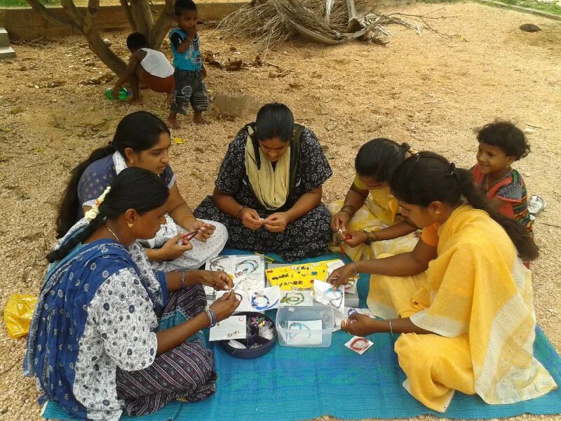 Women are given jewellery making training after field work.