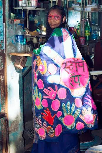 Anjali Amma, 50, who can hardly read and write herself, proudly appliquéd the stark slogan, ‘Stop Rape’ on the pallu of the blue hand-me-down silk sari. (Courtesy SNEHA)