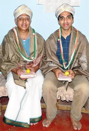 Vivek with his father Dr H.N. Lakshminarasimha Murthy, at Hallegere Village, Mandya, Karnataka