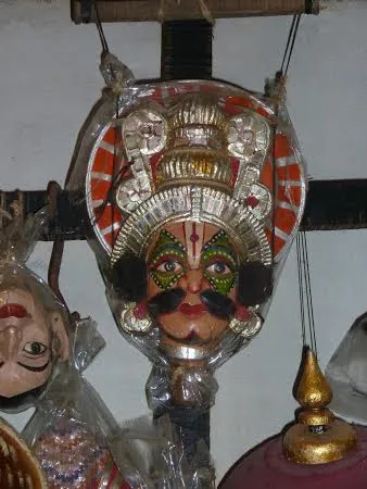 The  colourful puppet mask.