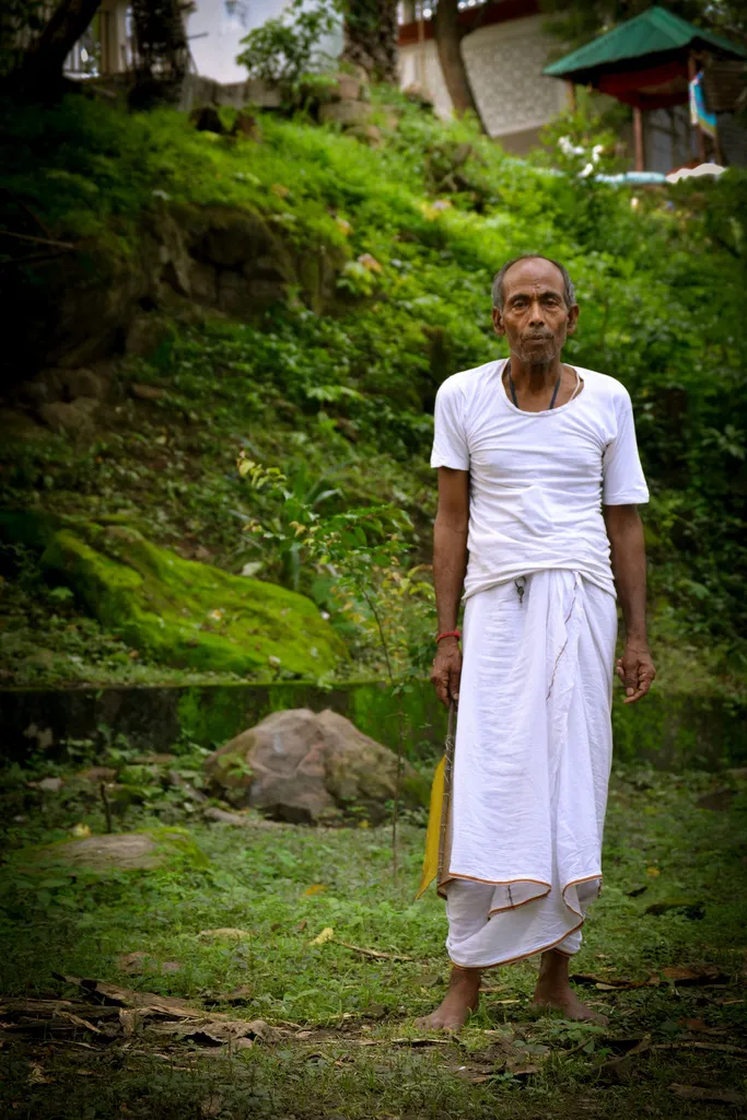 Seventy-one year old Tarun Sarma from Rangia, Assam is one of the few people who stays back on the island after all tourists, priests and shopkeepers leave every evening at five on the last ferry of the day. He is one of the descendants of the Brahmins who were called from Kanauj by King Singha to perform the first puja rituals in the temple. Two other priests and two fishermen remain here.
