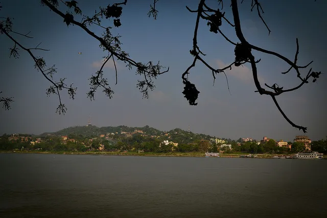 The trees watch over the city, which is growing by leaps and bounds. For Umananda, the grass is not greener on the other side