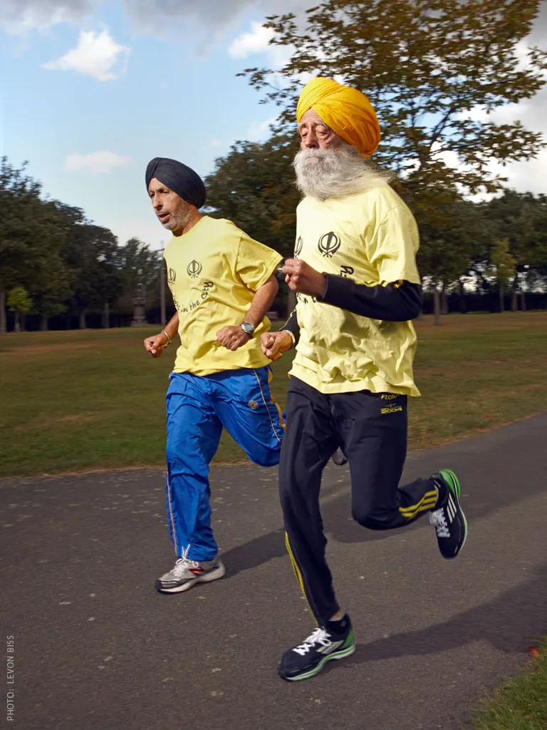 Coach Harmander Singh runs with Fauja in Valentines Park in Redbridge, London.