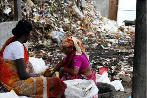 As they sift through garbage, waste pickers, who are mostly women, have to fend off stray animals, their hands get wounded by shards of broken glass thrown carelessly in the rubbish, and harassment by the police is part of their daily routine. (Credit: Amit Thavaraj) 