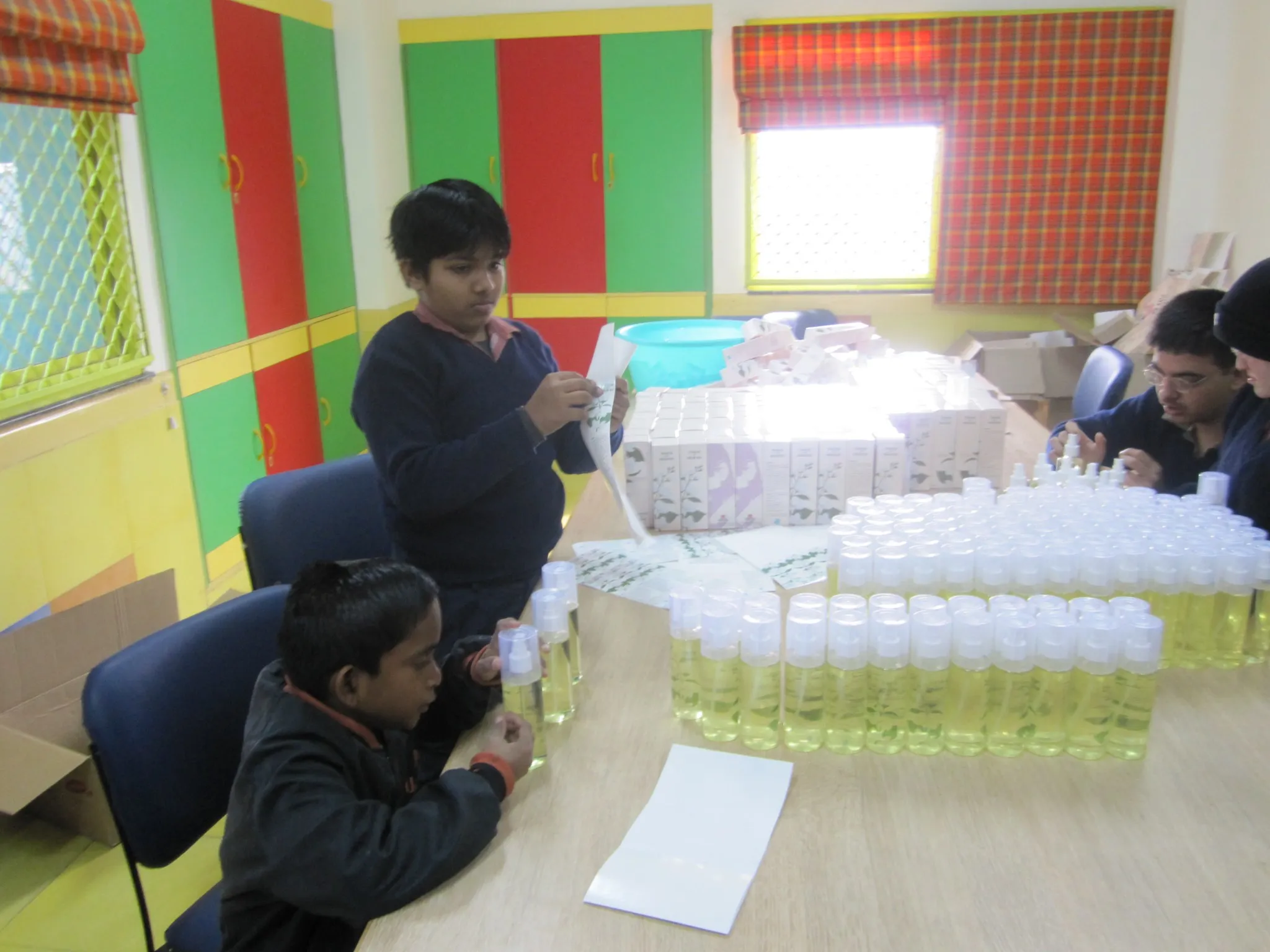 At the Savera School, children battling with physical and mental disorders such as Down's Syndrome and Autism are taught employable skills – like packing air fresheners that are eventually sold. (Credit: Naunidhi Kaur\WFS)