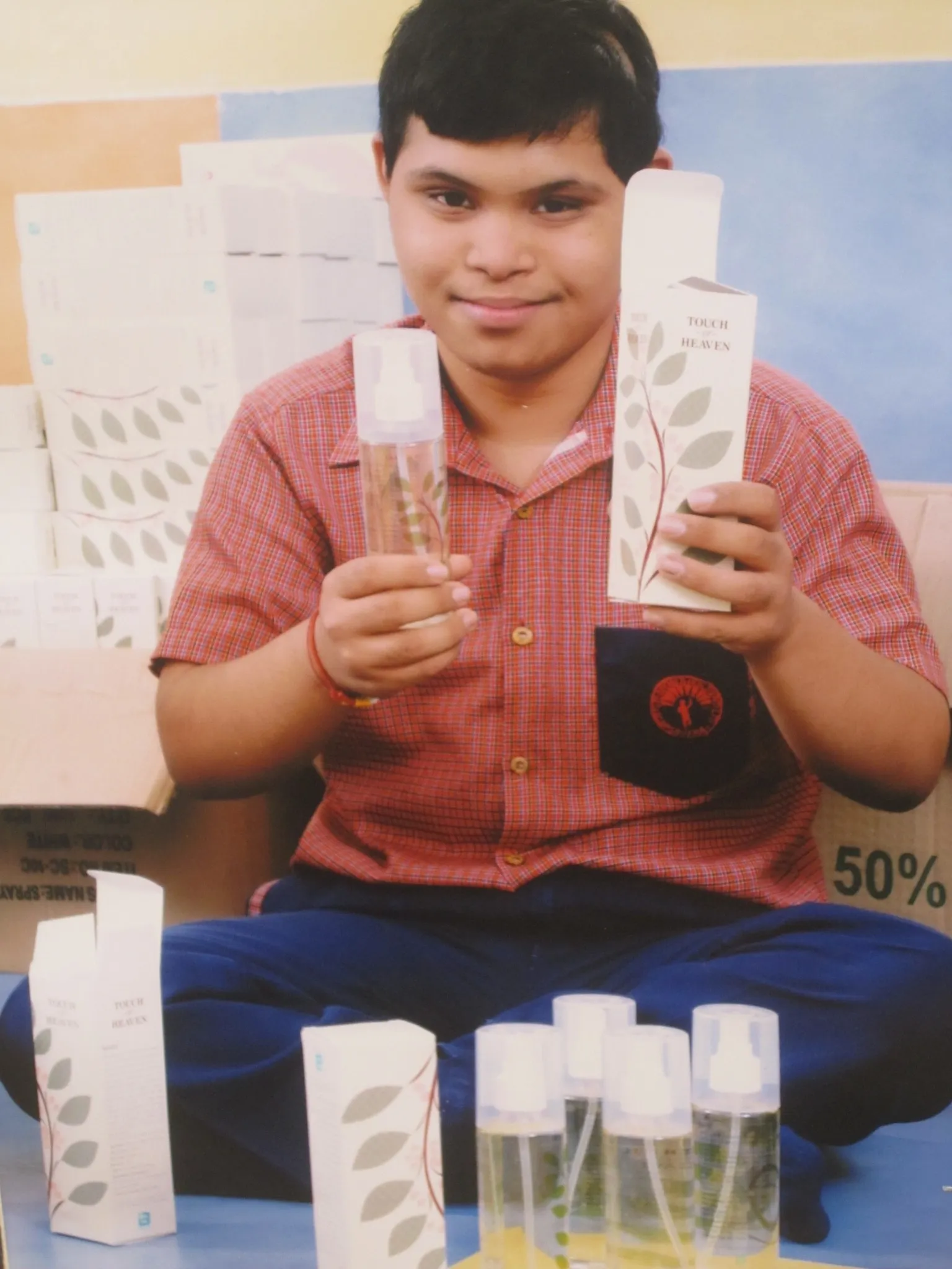 Among the various activities that are part of the vocational training programme at the Savera School, children pack air fresheners that are retailed under the brand name Touch of Heaven. (Credit: Naunidhi Kaur\WFS)